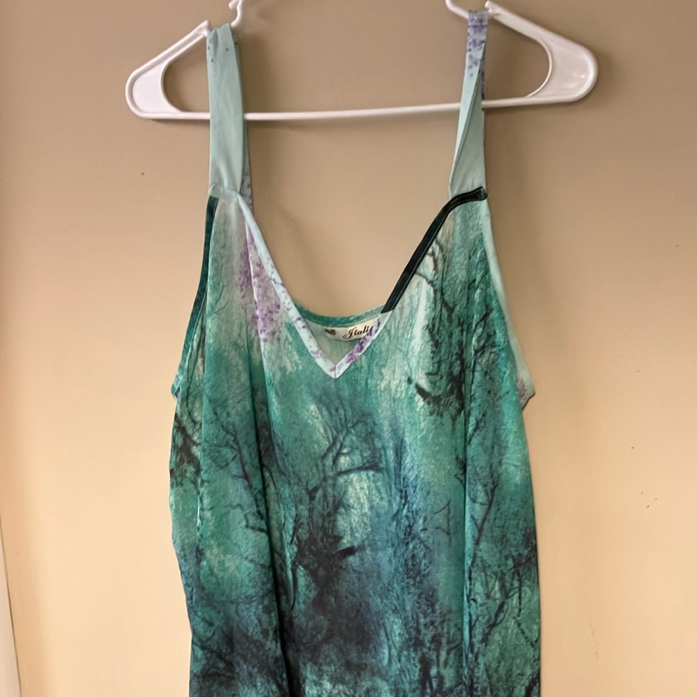 Jiali XXL. Shark bite, sheer, and light green with darker accent of purple.
